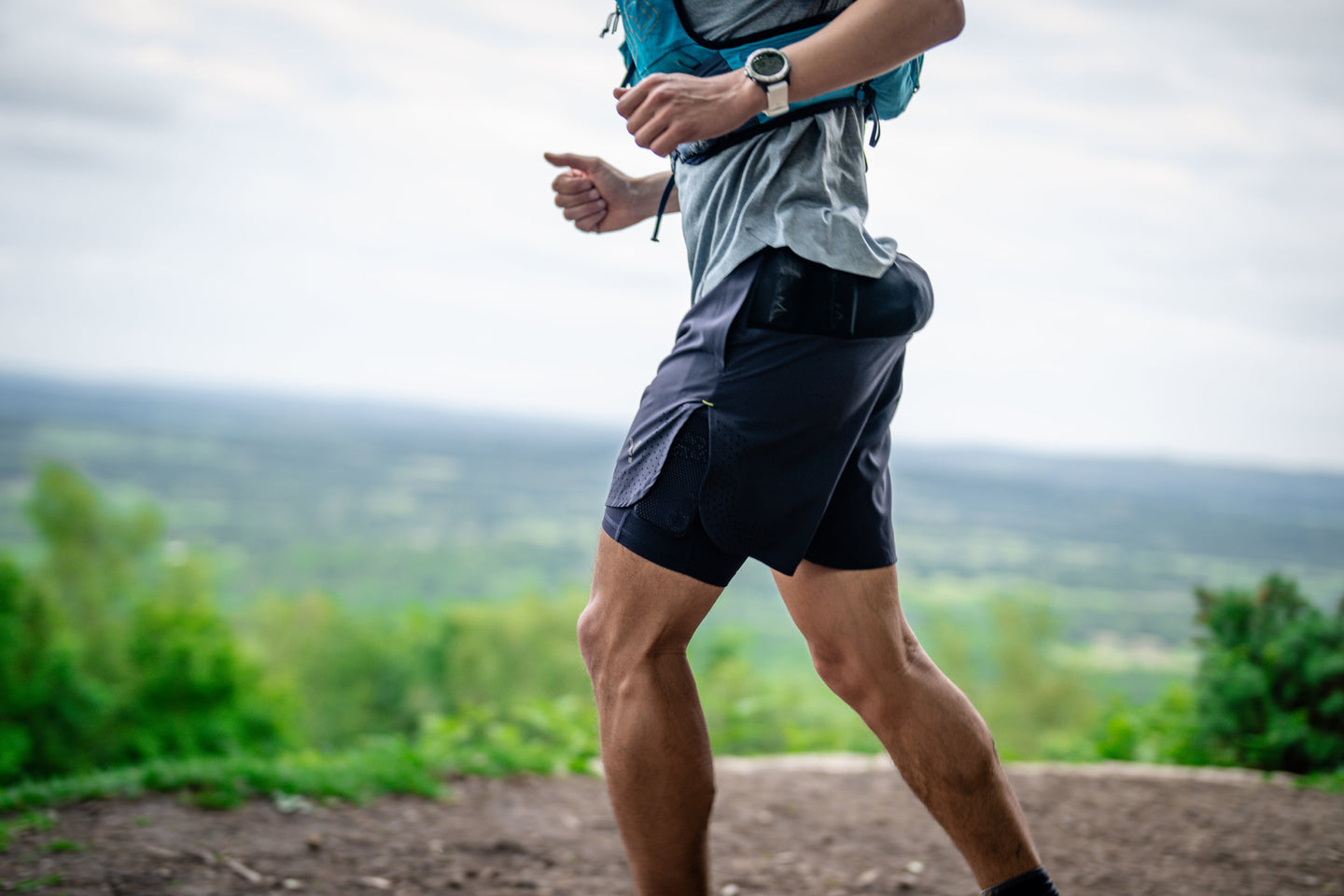 Man running on a forest trail