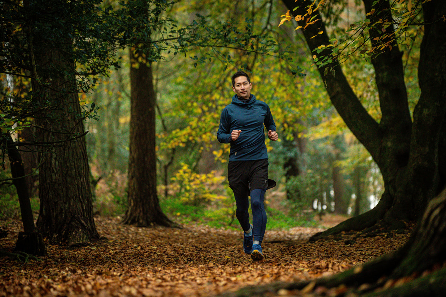 Person running through a forest