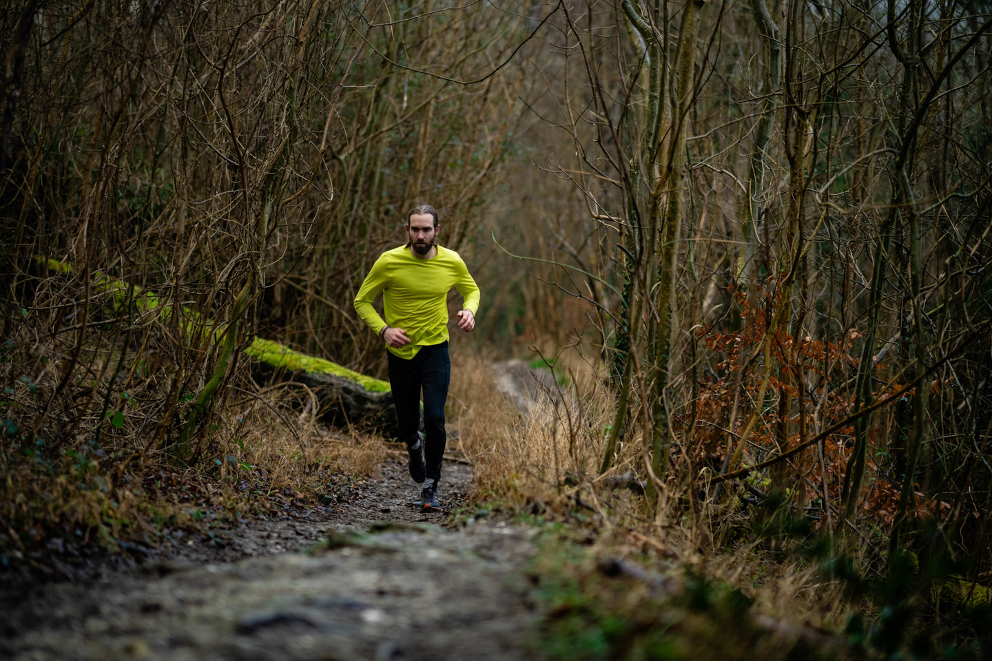 Man running on a forest path