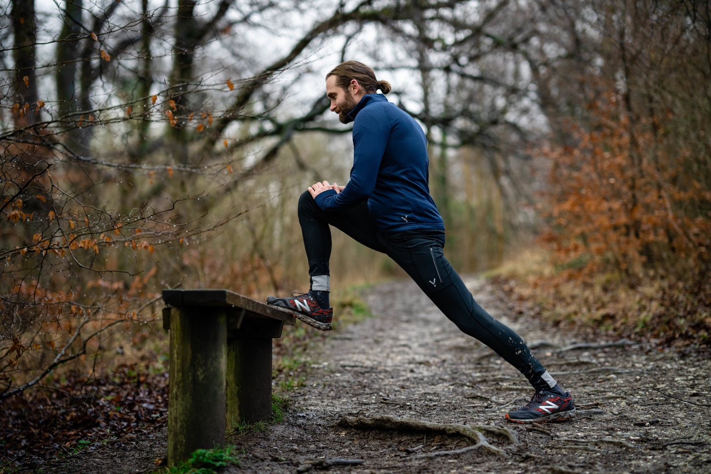 Person doing running stretches on a bench