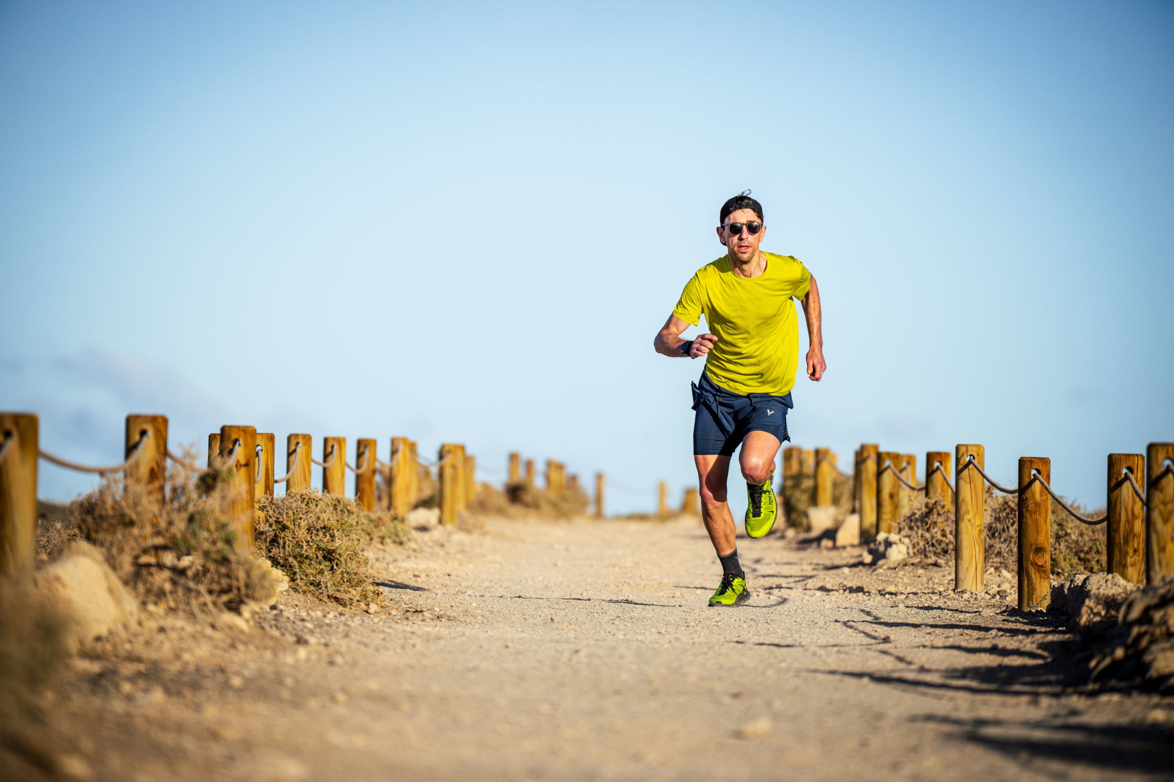 Man running on a sandy trail