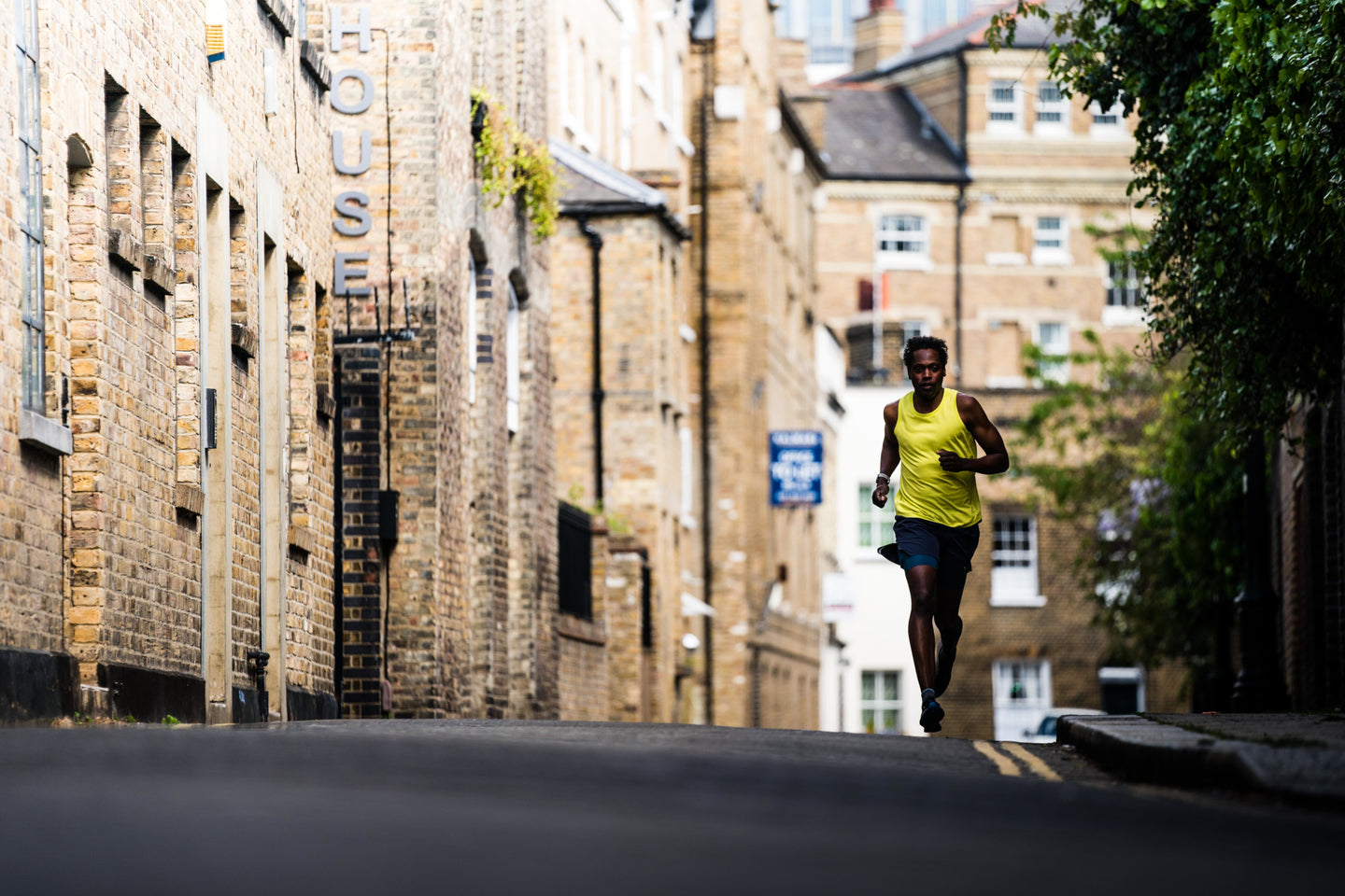 Man running down a city road