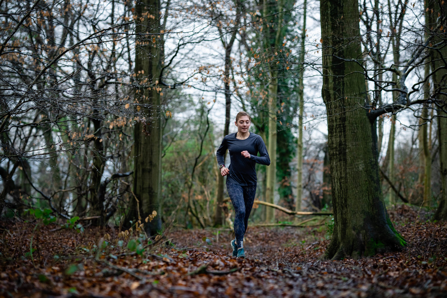 Person running through a forest